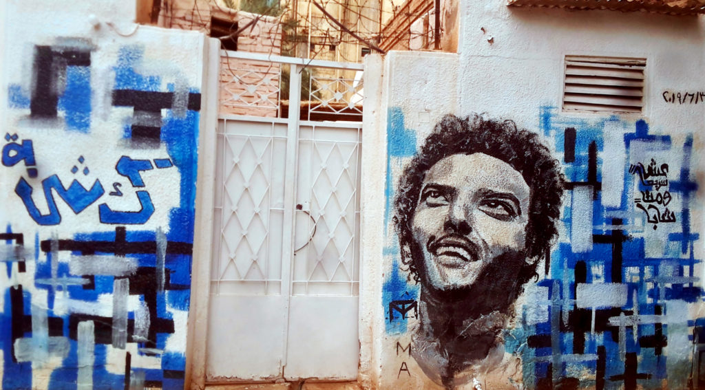 A mural on Abdelsalam Kisha’s house depicting him and his famous saying: “Live fast and die young”.